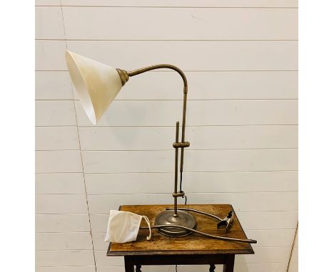 A desk lamp with a magnifying glass 