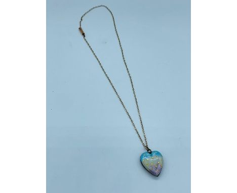 A 9ct gold chain(1.2g) with a heart shaped pendant with enamel decoration.