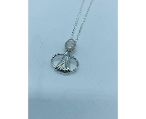 A silver and opal panelled renaissance style pendant necklace 