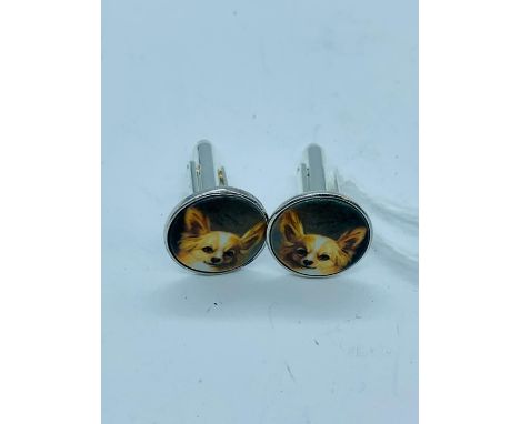 A pair of silver and enamel cuffllinks