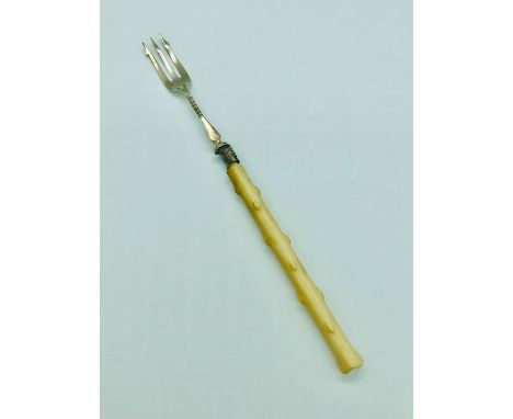 A hallmarked silver pickle fork