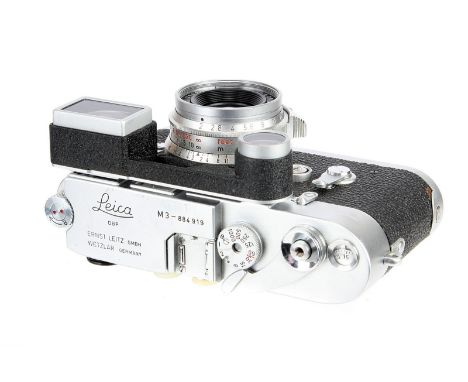 A Leica M3 DS Rangefinder Camera, 1957, type III, chrome, serial no. 884919, with Leitz Summicron f/2 35mm lens, 1965, with e