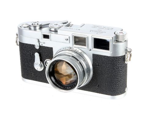 A Leica M3 DS Rangefinder Camera, 1955, type I, chrome, serial no. 730592, with Leitz Summicron f/2 50mm lens, 1954, chrome, 