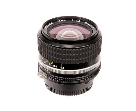 A Nikon Nikkor AIS f/2.8 24mm Lens, black, serial no. 834058, body, VG-E, elements, VG, some light internal haze, in maker’s 