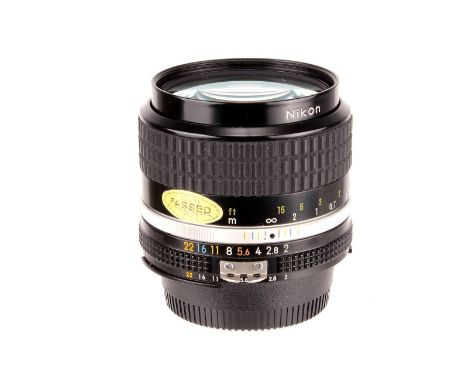 A Nikon Nikkor f/2 35mm AIS Lens, black, serial no. 211635, body, E, elements, VG, some very light internal haze, in maker’s 