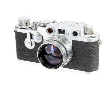 A Leica IIIf Red Dial Delay Rangefinder Camera, 1954, chrome, serial no. 698673, with Leitz Summitar f/2 50mm lens, 1950, chr