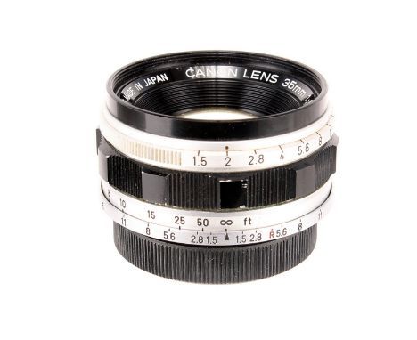 A Canon f/1.5 35mm Lens, chrome, serial no. 12067, body, G, elements, VG, some light internal haze, with maker’s caps; higher