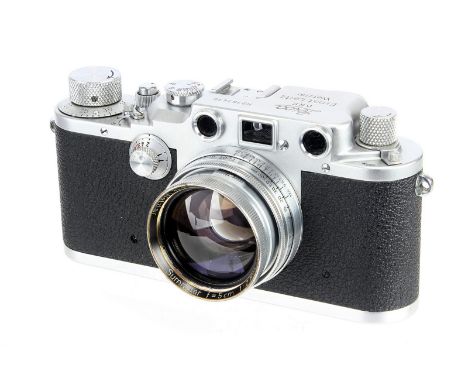 A Leica IIIc Rangefinder Camera, 1940, chrome, red blind, serial no. 363430, with Leitz Summitar f/2 50mm lens, 1939, chrome,