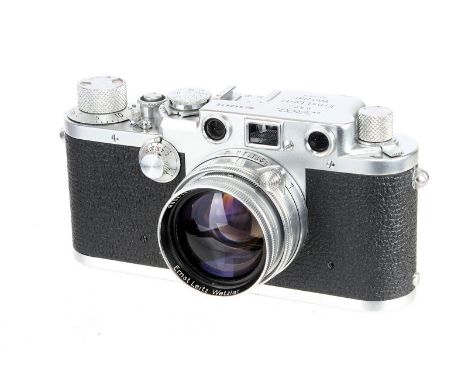 A Leica IIIf Rangefinder Camera, 1951, chrome, serial no. 543412, with Leitz Summitar f/2 50mm lens, 1950, chrome, serial no.