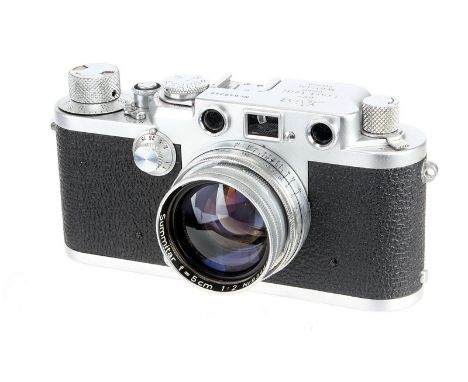 A Leica IIIf Red Dial Rangefinder Camera, 1952/53, chrome, serial no. 649349, with Leitz Summitar f/2 50mm lens, 1951, chrome