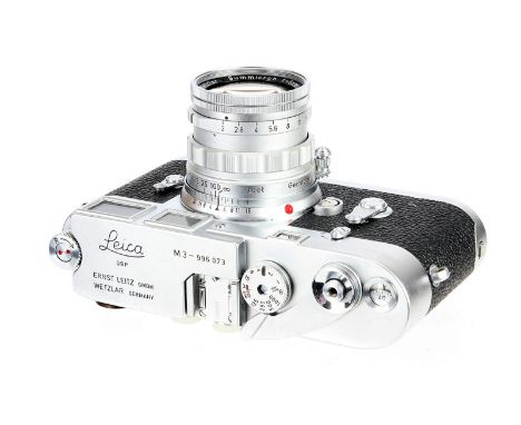 A Leica M3 Rangefinder Camera, 1959, type III, chrome, serial no. 996073, with Leitz Summicron f/2 50mm lens, 1958, chrome, s