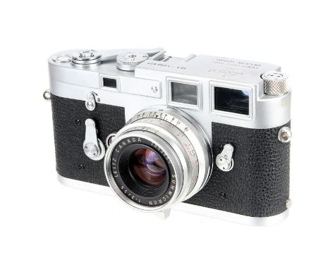 A Leica M3 Rangefinder Camera, 1964, type III, chrome, serial no. 1090625, with Leitz Summicron f/2 35mm lens, 1961, chrome, 
