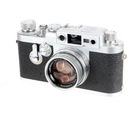 A Leica IIIg Rangefinder Camera, 1959, chrome, serial no. 956490, with Leitz Summicron f/2 50mm lens, 1956, chrome, serial no