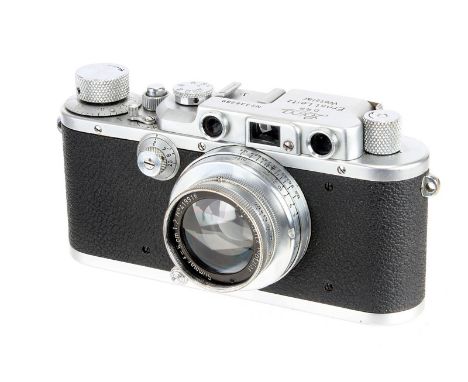 A Leica III Rangefinder Camera, 1939, chrome, serial no. 338299, with Leitz Summar f/2 50mm lens, 1938, chrome, serial no. 41