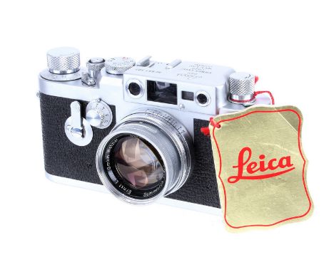 A Leica IIIg Rangefinder Camera, 1960, chrome, serial no. 981307, with Leitz Summicron f/2 50mm lens, 1957, chrome, serial no