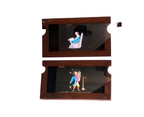 Mahogany-mounted Magic Lantern Slides: comic scene double slipper slides, hand painted, 175 x 102mm, G (7) 