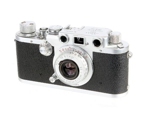 A Leica IIIf Black Dial Rangefinder Camera, 1951, chrome, serial no. 565801, with Leitz Elmar f/3.5 50mm lens, 1953, red scal