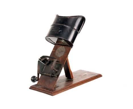 A Kinora Viewer, mounted on wooden-plinth, with manual hand crank drive, body, G, optics, slight chip to corner 