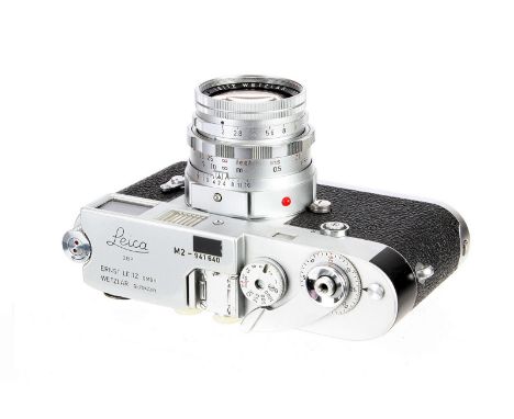 A Leica M2 Rangefinder Camera, 1958, type I, chrome, serial no. 941640, with Leitz Summicron f/2 50mm lens, 1960, without eye