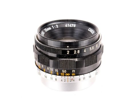 A Canon f/2 35mm Lens, black, serial no. 41478, body, G, elements, VG, some light internal haze, with maker’s caps