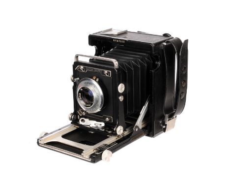 A Graflex Century Graphic Camera, serial no. 519230, 2¼x3¼”, with Graftar f/4.5 103mm lens, body, VG, lens, VG, shutter worki