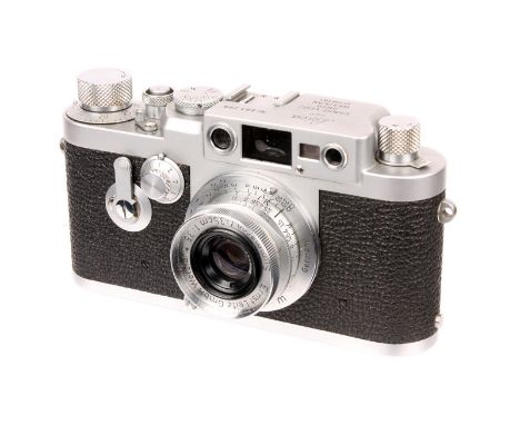 A Leica IIIg Rangefinder Camera, 1959, chrome, serial no. 981299, with Leitz Summaron f/3.5 35mm lens, 1951, chrome, serial n