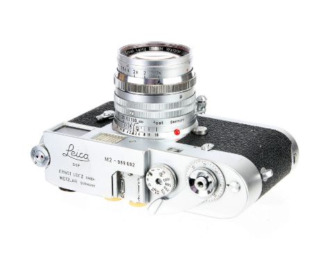 A Leica M2 Rangefinder Camera, 1960, type II, chrome, serial no. 989692, with Leitz Summarit f/1.5 50mm lens, 1957, chrome, s