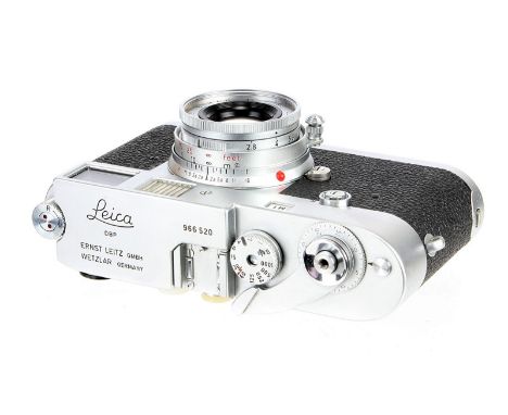 A Leica M1 Rangefinder Camera, 1959, chrome, serial no. 966520, with Leitz Elmar f/2.8 50mm lens, 1933, chrome, serial no. 19