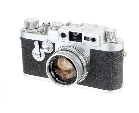 A Leica IIIg Rangefinder Camera, 1957, chrome, serial no. 825127, with Leitz Summicron f/2 50mm lens, 1957, chrome, serial no