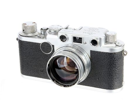 A Leica IIIf Red Dial Rangefinder Camera, 1953, chrome, serial no. 650561, with Leitz Summitar f/2 50mm lens, 1951, coated, c