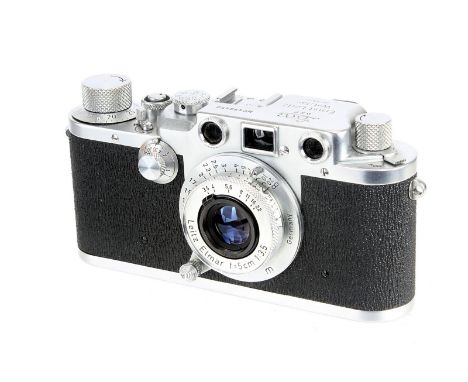 A Leica IIIc Rangefinder Camera, 1948/50, chrome, sharkskin, serial no. 499450, with Leitz Elmar f/3.5 50mm lens, 1950, chrom