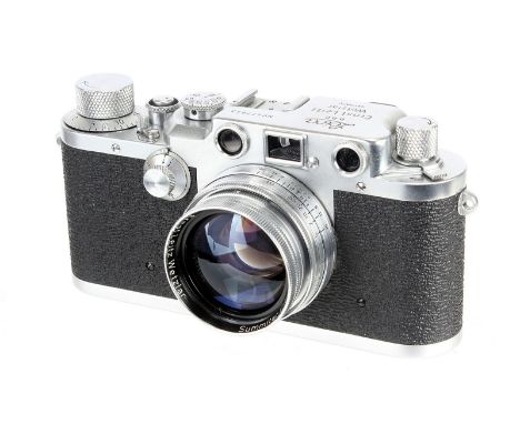 A Leica IIIc Rangefinder Camera, 1948/50, chrome, sharkskin, serial no. 477643, with Leitz Summitar f/2 50mm lens, 1949, chro