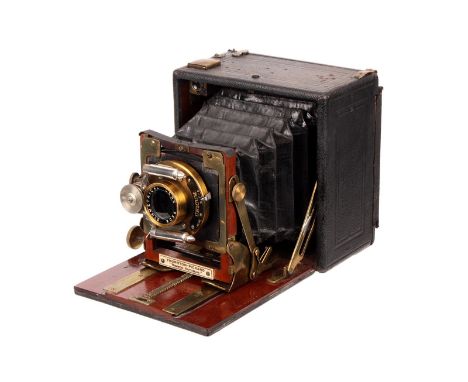 A Thornton Pickard Nimrod Automan Hand & Stand Camera, serial no. 33, with Beck Symmetrical f/8 brass lens, in Unicum shutter