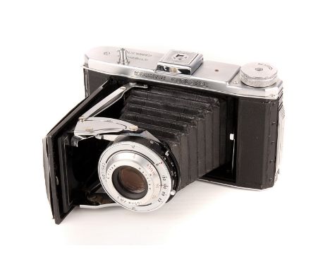 A Kershaw Curlew III Camera, chrome, serial no. 3/6460, with Critak f/4.5 105mm lens, body, G, lacking bed support arm, lens,