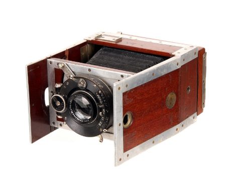 A Shew & Co. Xit Aluminium Mahogany Folding Strut Camera, 6x9cm, with Carl Zeiss Jena Tessar f/4.5 120mm lens, serial no. 176