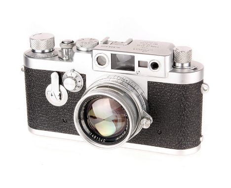 A Leica IIIg Rangefinder Camera, 1957, chrome, serial no. 906805, with Leitz Summicron f/2 50mm lens, 1957, chrome, serial no