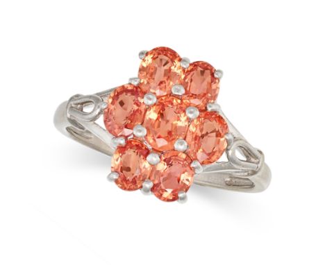 AN ORANGE SAPPHIRE CLUSTER RING in 18ct white gold, set with a cluster of oval cut orange sapphires, stamped 750, size M / 6.