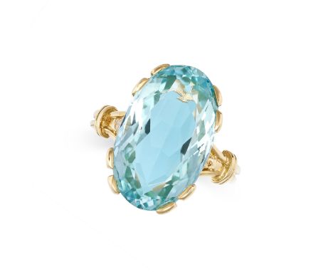 AN AQUAMARINE AND DIAMOND COCKTAIL RING in yellow gold, set with an oval cut aquamarine of approximately 8.70 carats, accente