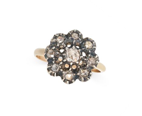 AN ANTIQUE DIAMOND CLUSTER RING in yellow gold and silver, set with a floral cluster of rose cut diamonds, no assay marks, si