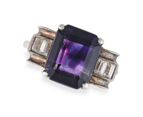 AN AMETHYST AND WHITE GEMSTONE RING set with an octagonal step cut amethyst accented by rows of baguette cut white paste, no 