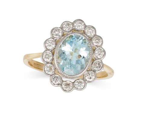 AN AQUAMARINE AND DIAMOND CLUSTER RING in 18ct yellow and white gold, set with an oval cut aquamarine of approximately 1.50 c