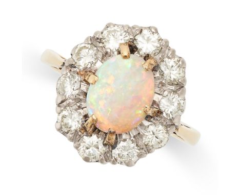 A VINTAGE OPAL AND DIAMOND CLUSTER RING in 18ct yellow gold, set with a cabochon opal in a cluster of round brilliant cut dia