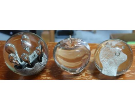 Tiffany &amp; Co clear glass paperweight in the form of an apple, Caithness Carnival glass paperweight and another paperweigh