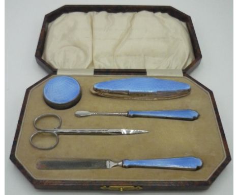 George V hallmarked silver and blue enamel five piece manicure set with steel scissors, in original fitted box, Birmingham 19