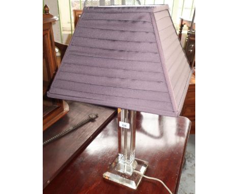 Contemporary table lamp with clear column and pleated grey shade 
