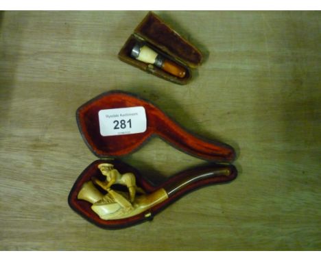 Cased Meerschaum type pipe with amber tip in the form of a boy boating, and a cased cheroot holder with silver hallmarked mou