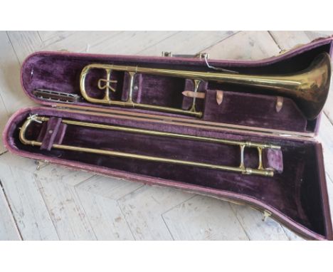 Roth Reynolds Trombone No. 88537, in fitted case, and a Fischer Chromatic Harmonica 