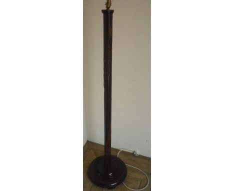 Carved Chinese hardwood standard lamp on circular base 