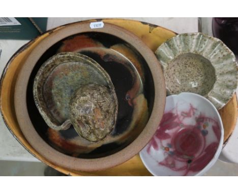 Studio pottery dish, other studio pottery, large Indian brass bowl, two Indian wooden trays, a letter rack, a brass inkwell, 