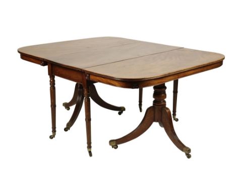 GOOD?GEORGE III MAHOGANY DINING TABLE CIRCA 1810 comprising a central butterfly action section, ring-turned legs and two D-en